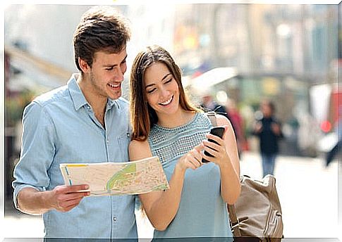 Tourists consulting a smartphone