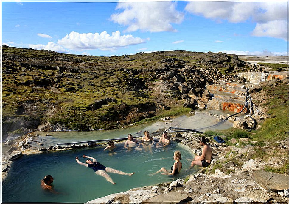 Tourists enjoying the hot springs of Hveravellir.