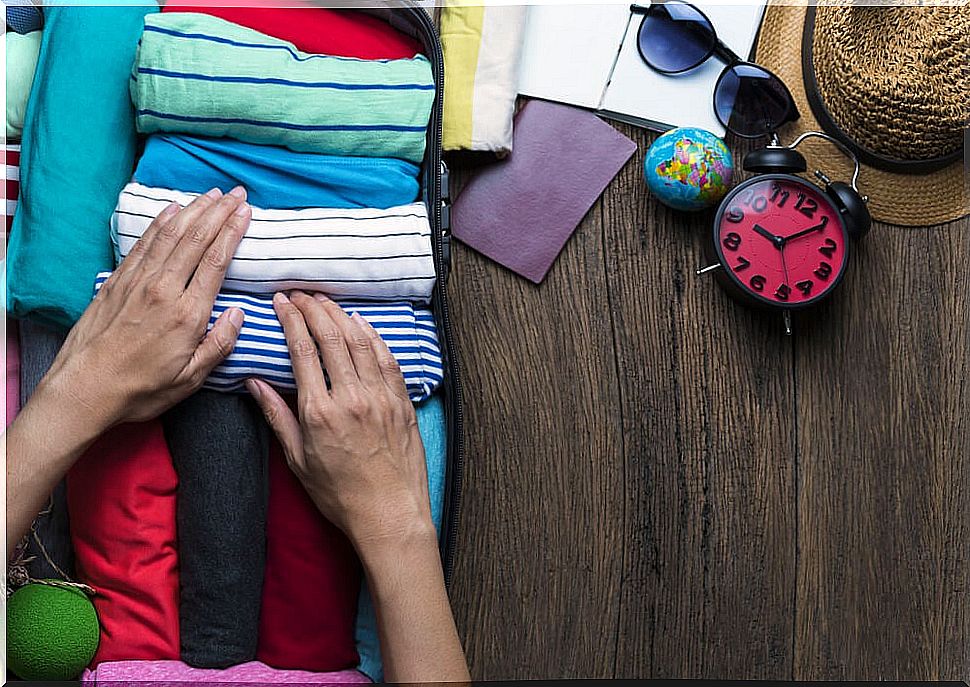 Woman packing hand suitcase