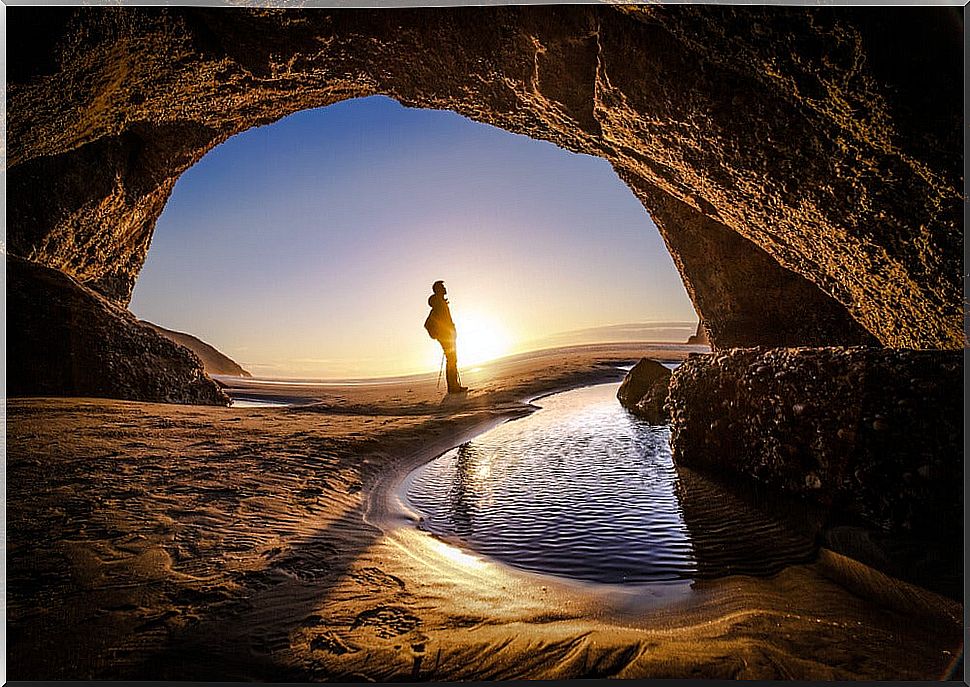 Traveler in a cave