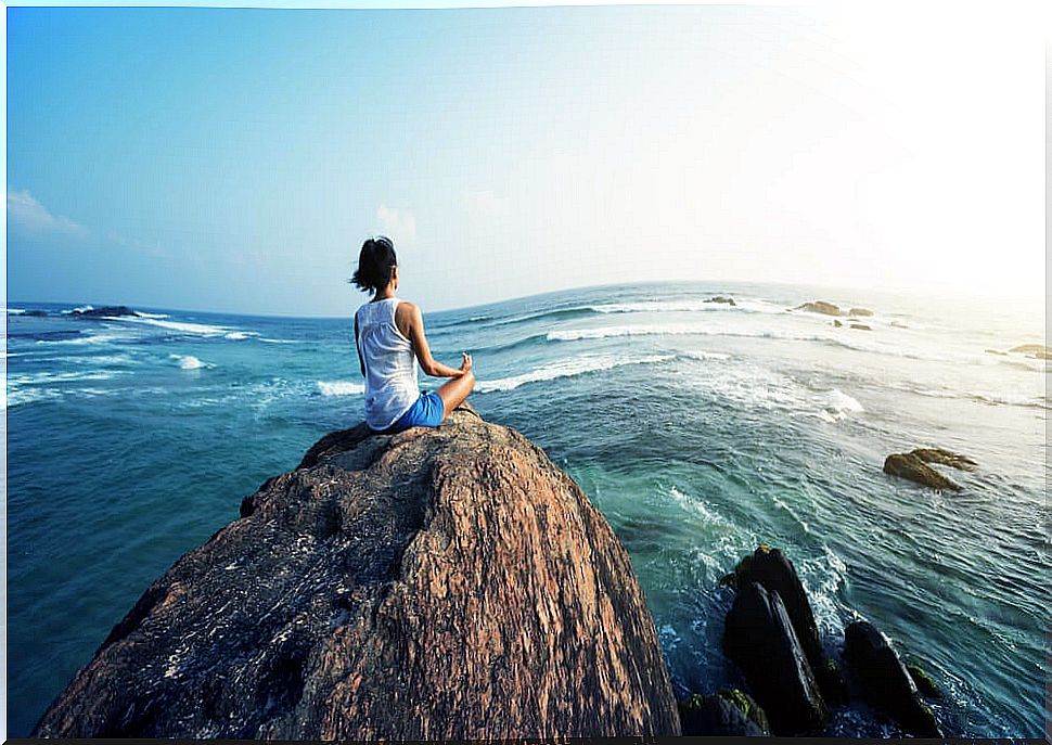 Woman meditating practicing the tips of the Traveler's Tao