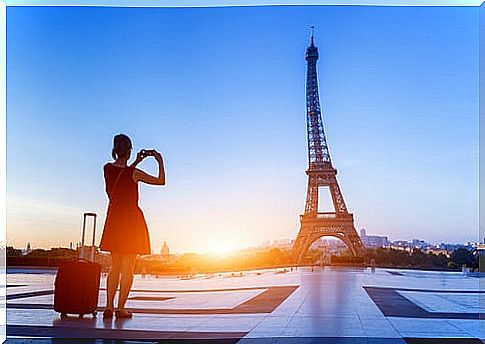 Traveler visiting Paris after packing her suitcase